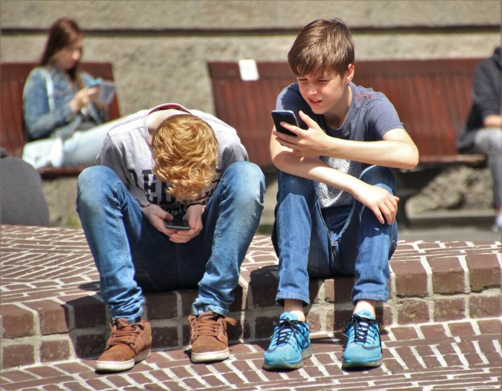 teens looking at their phones